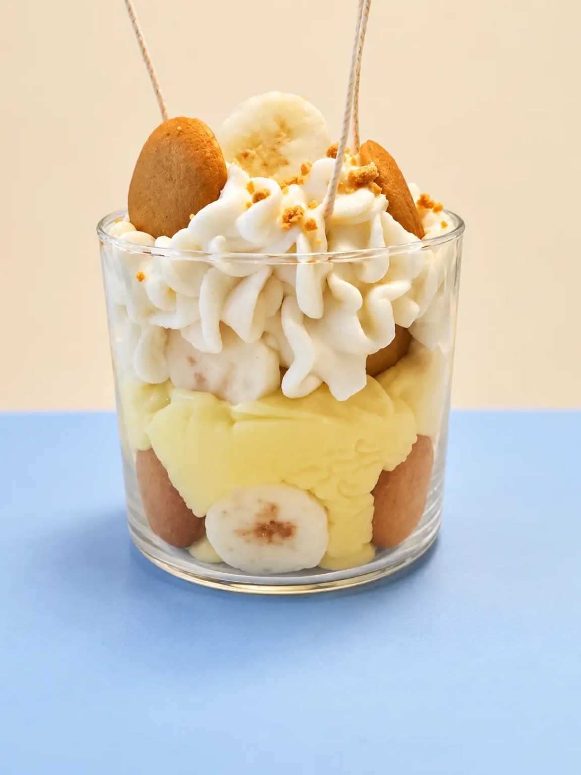 Handmade banana pudding candle in a clear glass vessel