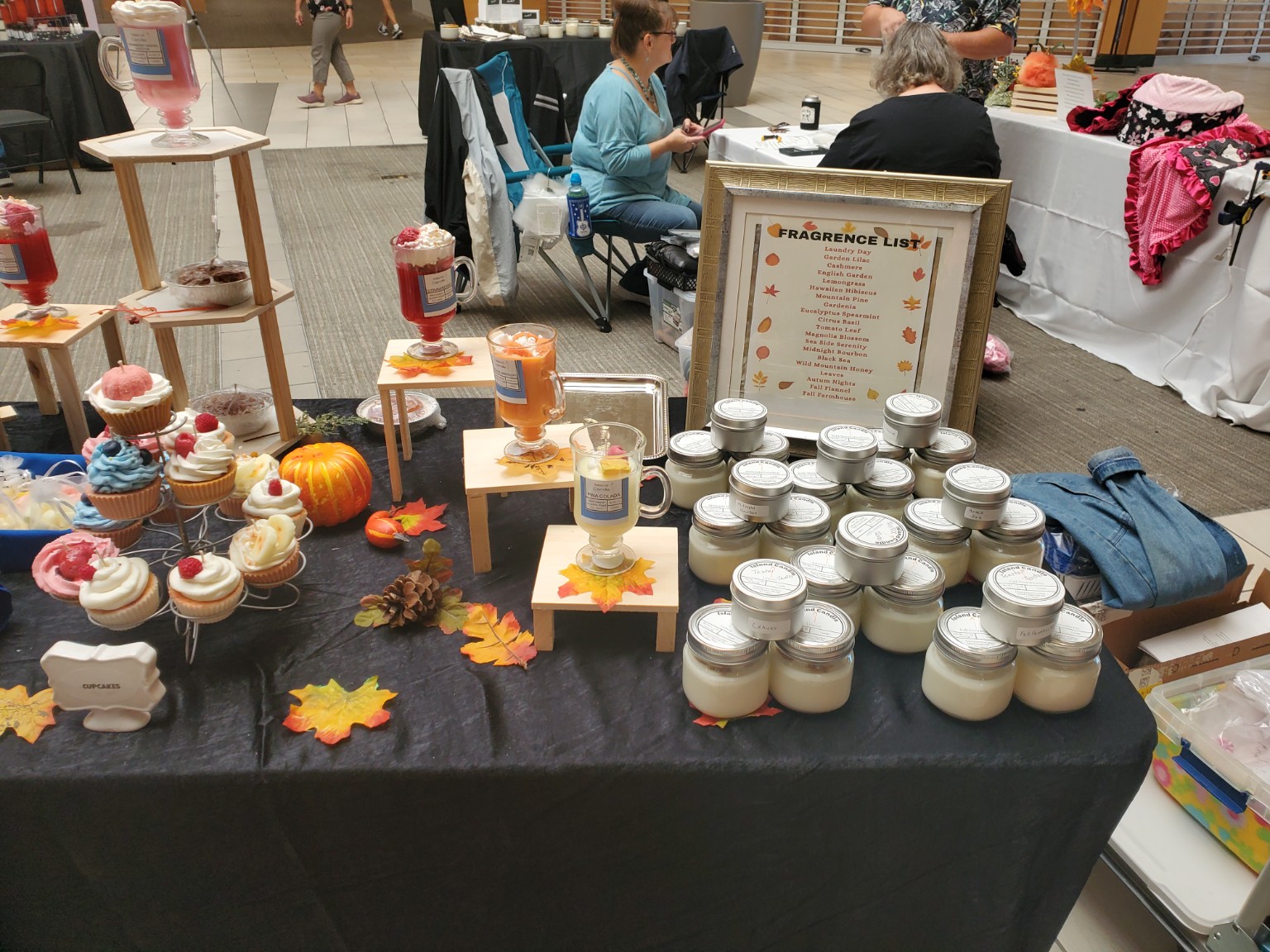 Fall candle display with fragrance list and jar candles