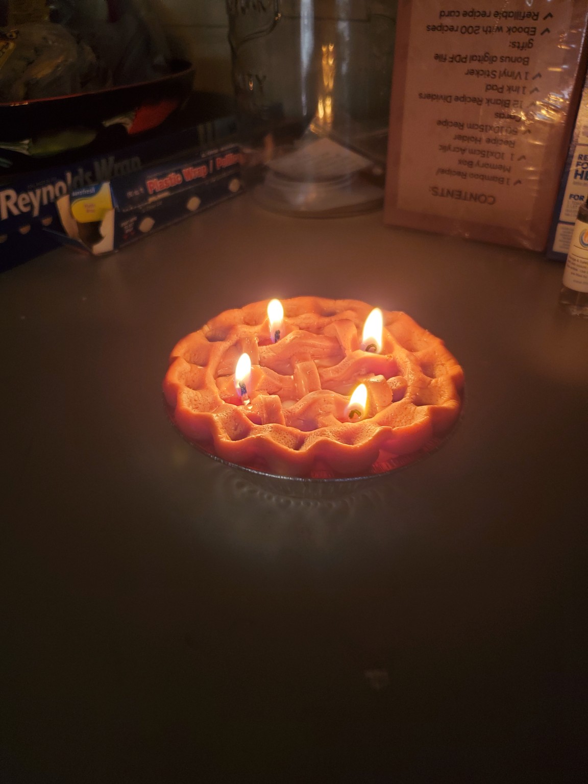 Four-wick pie candle burning during a test