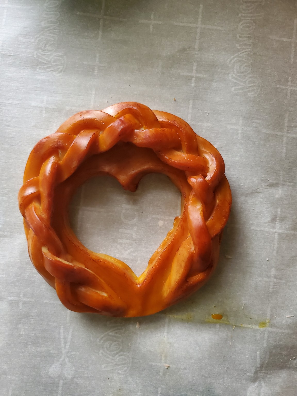 Braided wax pie crust arranged around a heart-shaped center