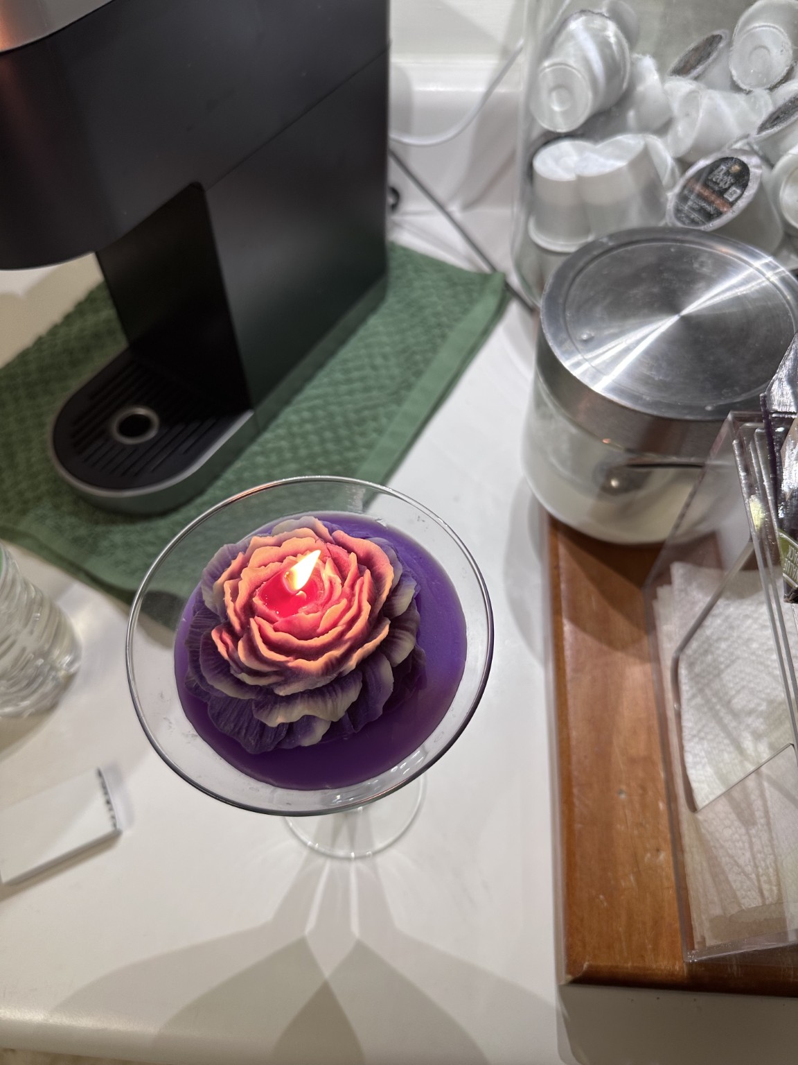 Purple floral Martini Bouquet candle burning during a test